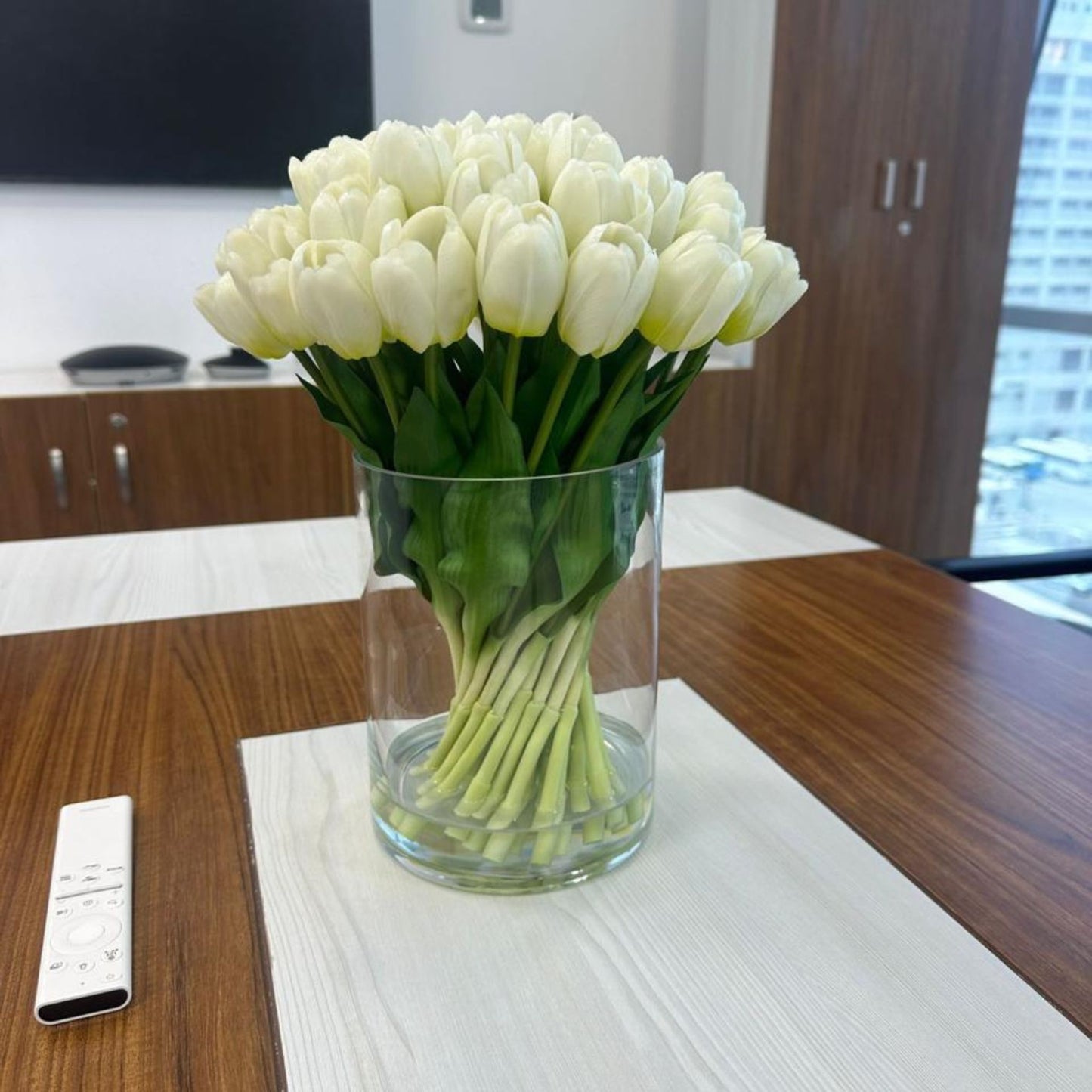 ARTIFICIAL WHITE TULIPS IN GLASS VASE
