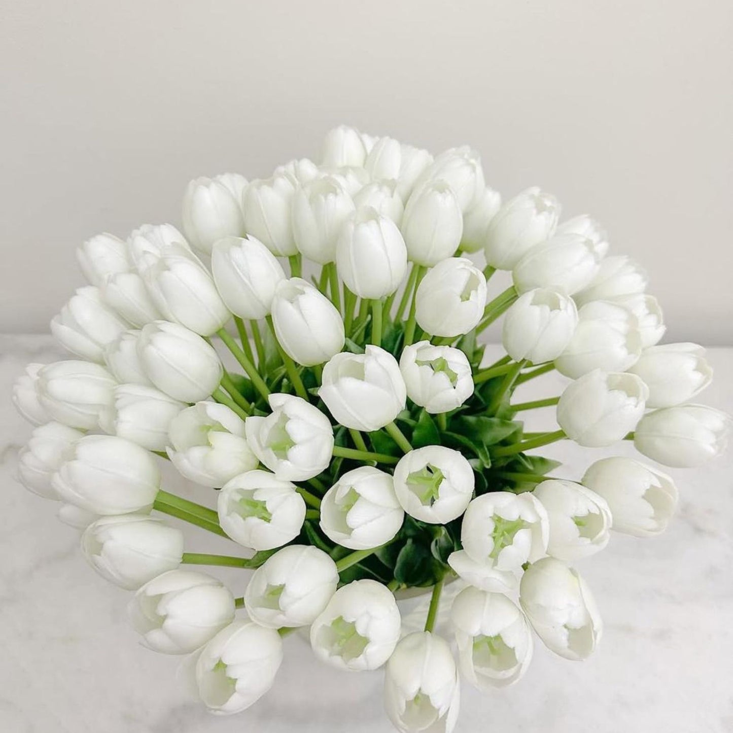 ARTIFICIAL WHITE TULIPS IN GLASS VASE