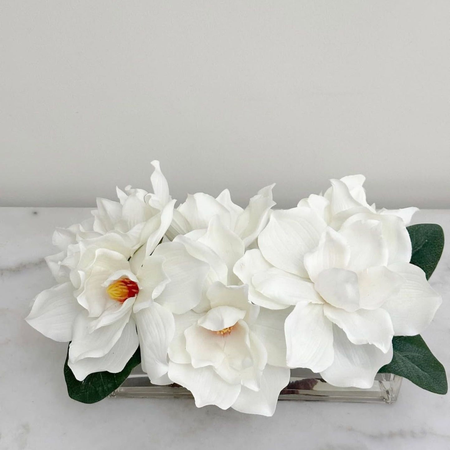ARTIFICIAL MAGNOLIA IN RECTANGULAR GLASS VASE